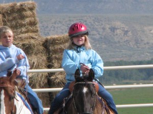 Kids riding horses alone